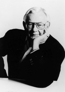 Black and white portrait of elderly man with glasses