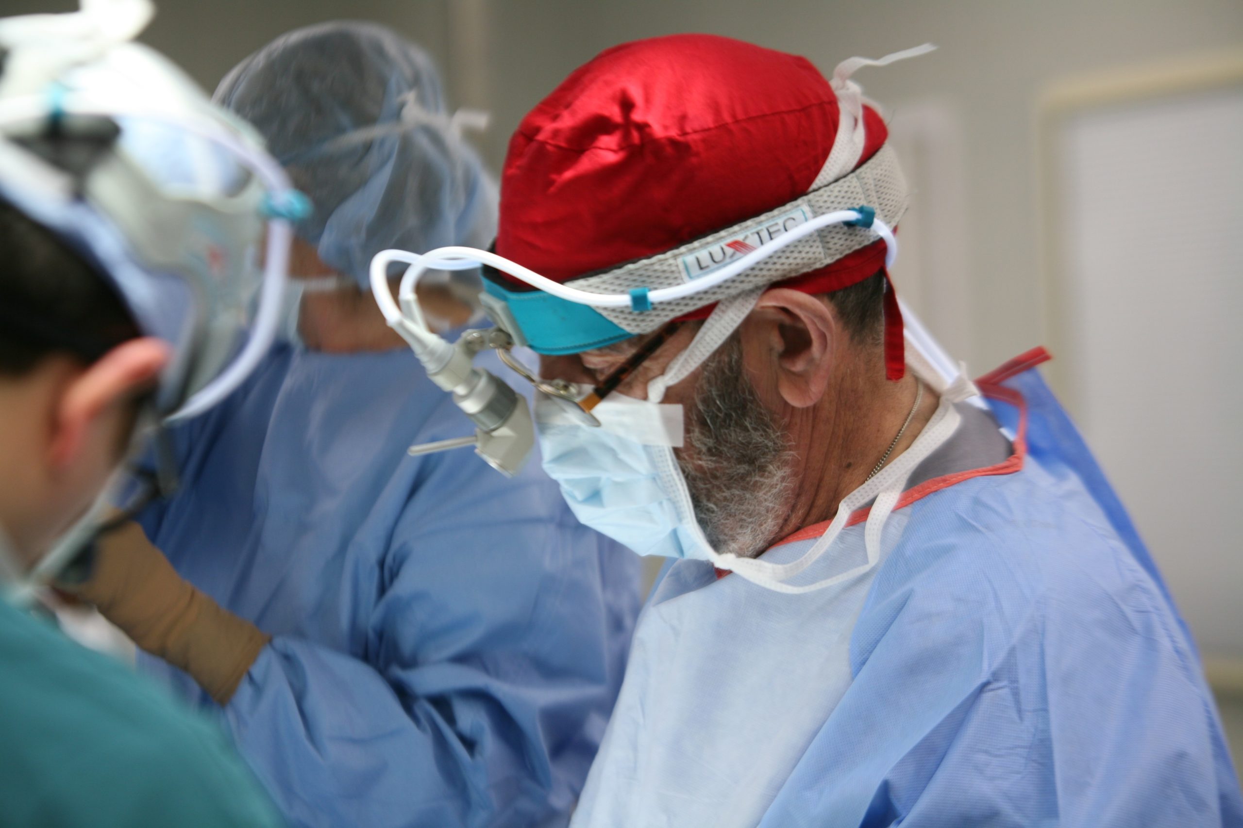 man performing surgery