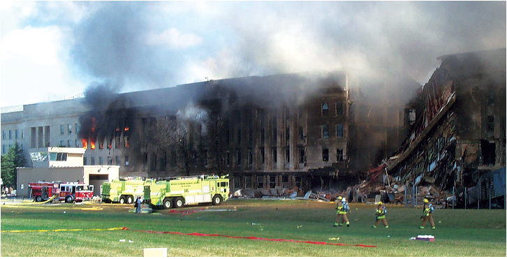 The collapsed portion of the Pentagon with emergency crews on-site.
